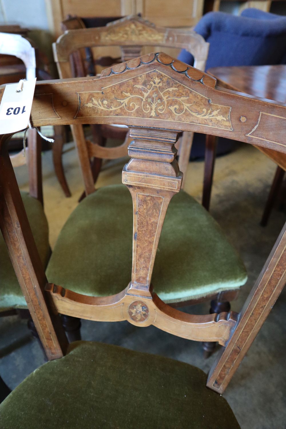 A set of four Victorian inlaid walnut dining chairs